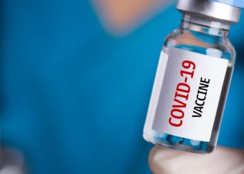 Who got at least one COVID-19 vaccine dose?